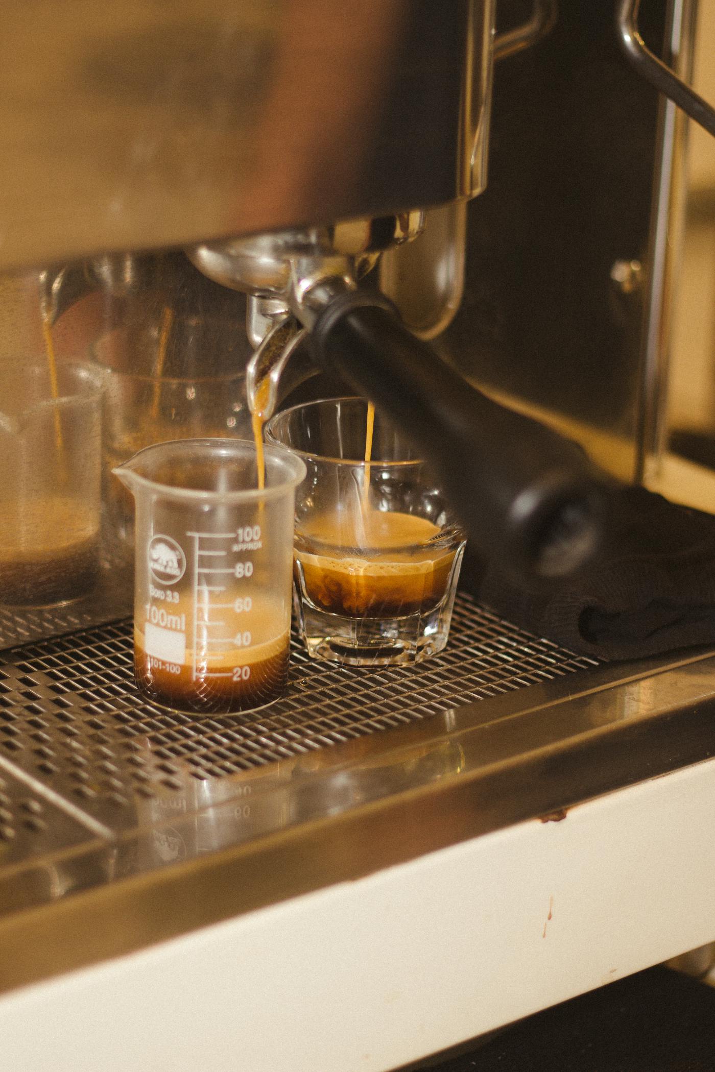 Espresso extracting from a machine into a glass