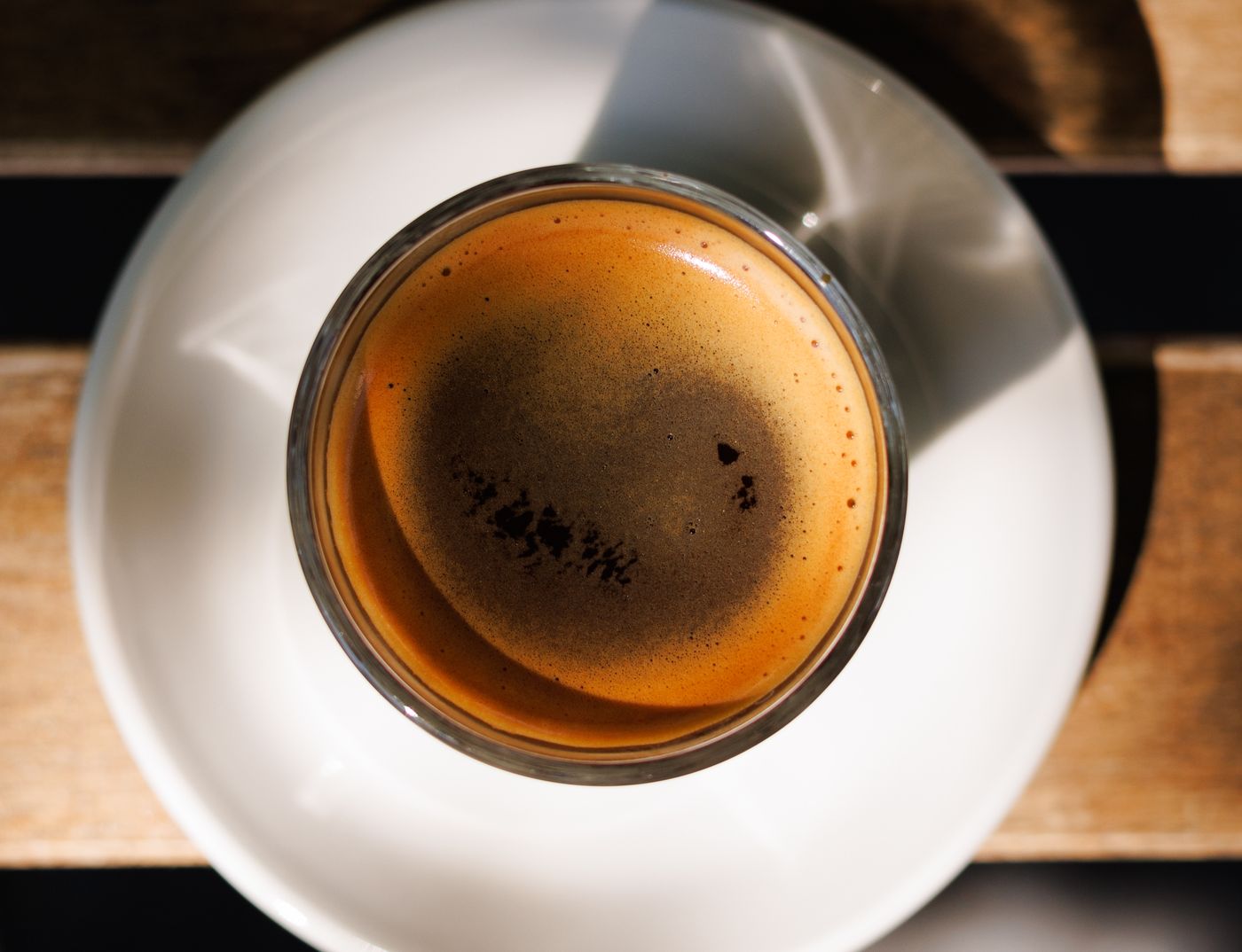 Top-down view of a freshly brewed espresso in a glass