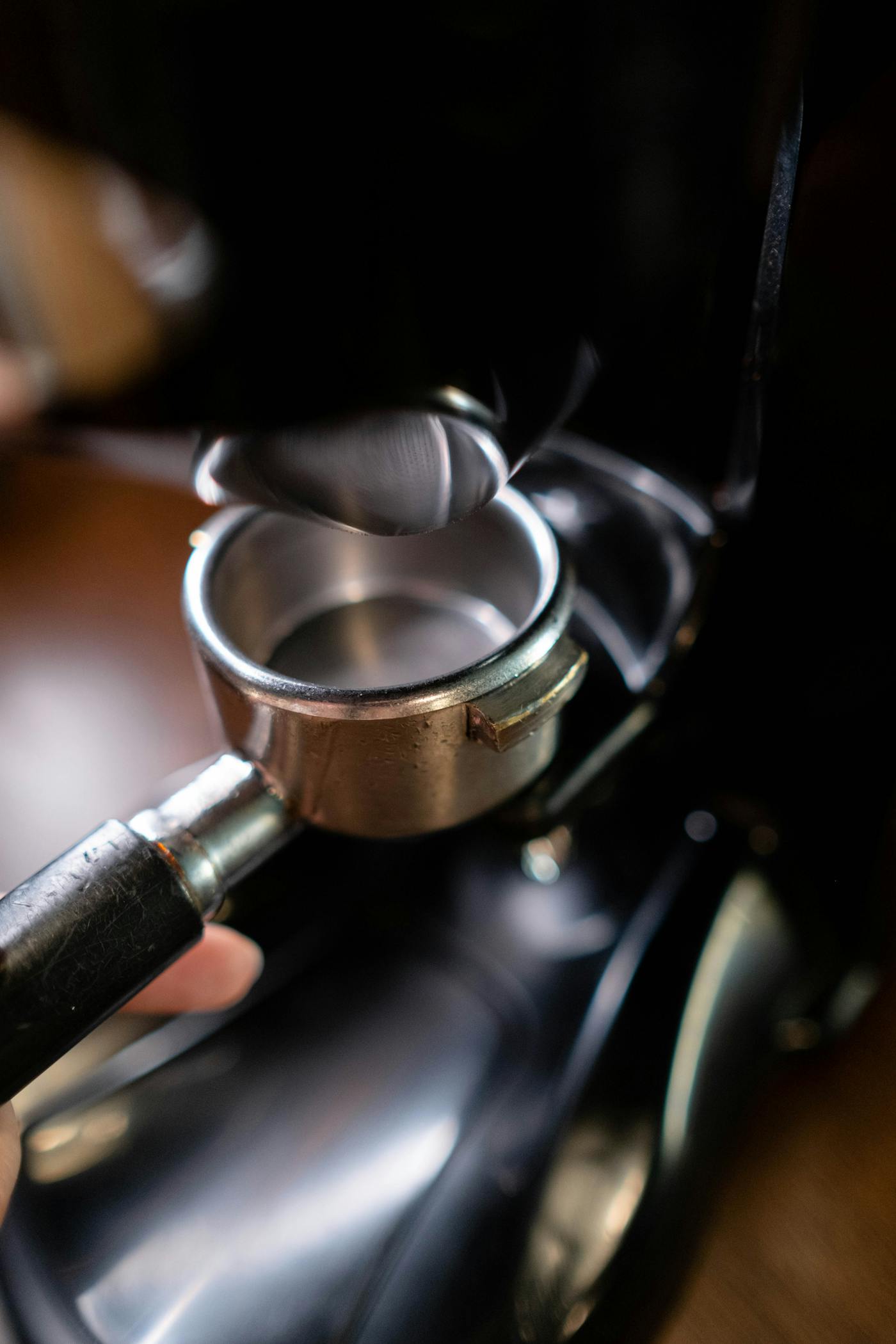 Close-up of a portafilter and espresso machine group head